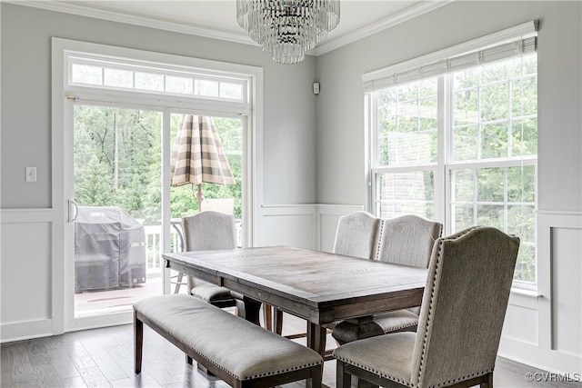 14812 Diamond Creek Ter, Chesterfield, VA 23113 - dining space with a decorative wall, ornamental molding, a chandelier, healthy amount of natural light, and wood finished floors
