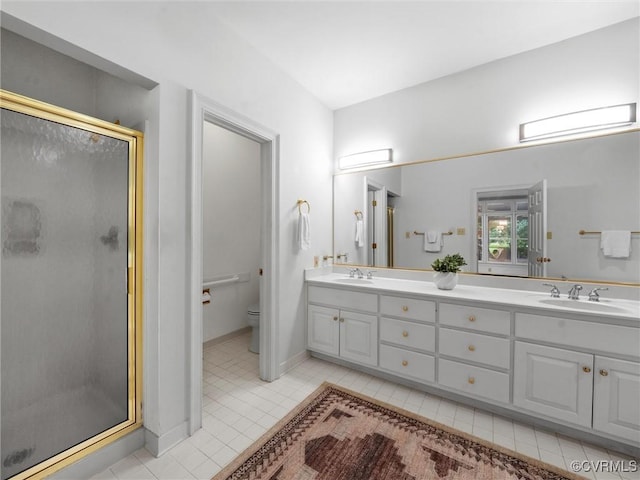 9313 Owl Trace Ct, Chesterfield, VA 23838 - bathroom featuring tile patterned floors, double vanity, and a shower stall