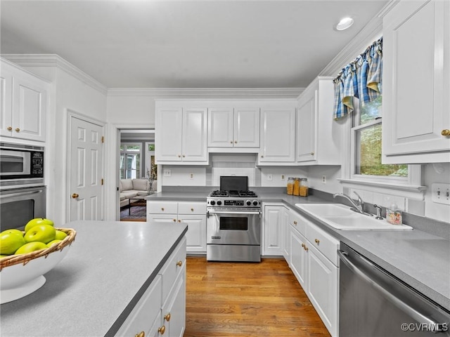 9313 Owl Trace Ct, Chesterfield, VA 23838 - kitchen featuring stainless steel appliances, plenty of natural light, white cabinets, and ornamental molding