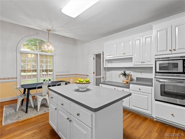 9313 Owl Trace Ct, Chesterfield, VA 23838 - kitchen with stainless steel appliances, light wood-style flooring, and white cabinetry