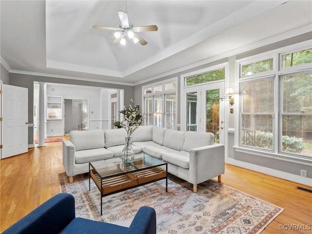 9313 Owl Trace Ct, Chesterfield, VA 23838 - living room featuring a raised ceiling, ceiling fan, wood finished floors, decorative columns, and crown molding