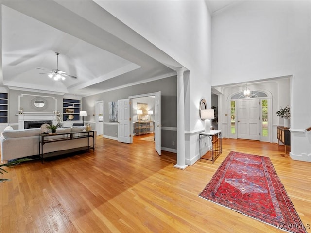 9313 Owl Trace Ct, Chesterfield, VA 23838 - living area featuring ceiling fan, light wood-style floors, decorative columns, built in shelves, and a fireplace