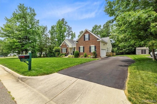 206 Twin Crest Dr, Chesterfield, VA 23236 - view of front of house with brick siding, driveway, a storage shed, a garage, and a front yard