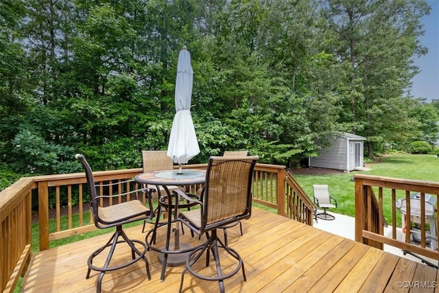 206 Twin Crest Dr, Chesterfield, VA 23236 - deck featuring outdoor dining area, a lawn, a storage unit, and view of scattered trees