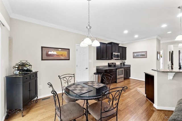 206 Twin Crest Dr, Chesterfield, VA 23236 - dining room featuring crown molding, recessed lighting, and light wood finished floors
