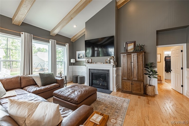 15813 Maclear Dr, Midlothian, VA 23112 - living room with beamed ceiling, light wood-style floors, a fireplace with flush hearth, healthy amount of natural light, and high vaulted ceiling