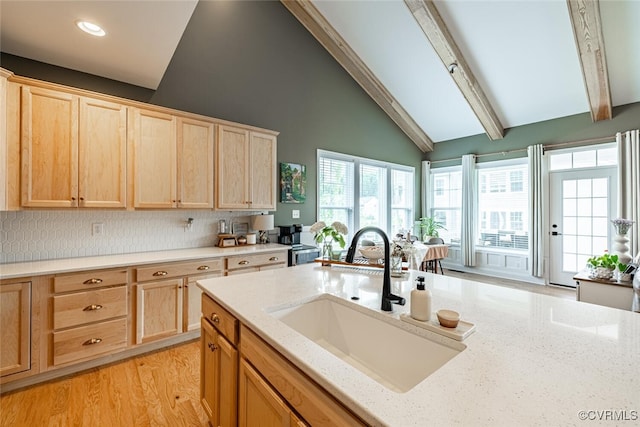 15813 Maclear Dr, Midlothian, VA 23112 - kitchen featuring light brown cabinetry, beam ceiling, light stone counters, recessed lighting, and high vaulted ceiling