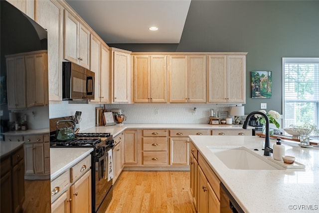 15813 Maclear Dr, Midlothian, VA 23112 - kitchen featuring black appliances, light brown cabinets, light wood-type flooring, recessed lighting, and tasteful backsplash