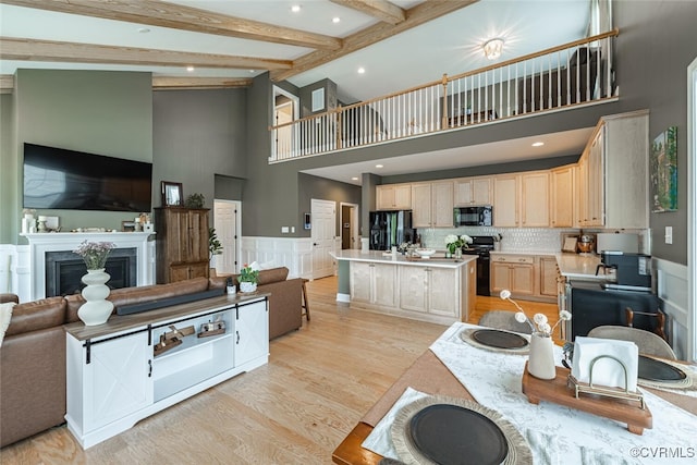 15813 Maclear Dr, Midlothian, VA 23112 - kitchen featuring black appliances, open floor plan, light brown cabinetry, high vaulted ceiling, and light countertops