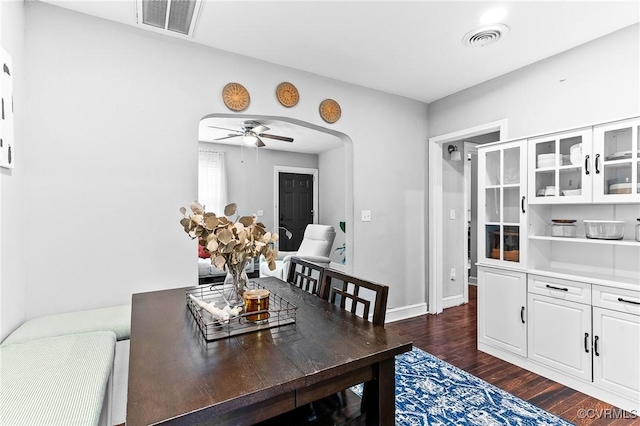 1426 Overlook St, Ampthill, VA 23224 - dining room featuring dark wood-type flooring, arched walkways, and a ceiling fan