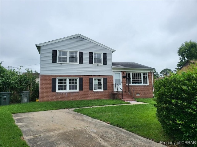 703 S Fallon Ct, Hampton, VA 23661 - tri-level home featuring brick siding and a front yard