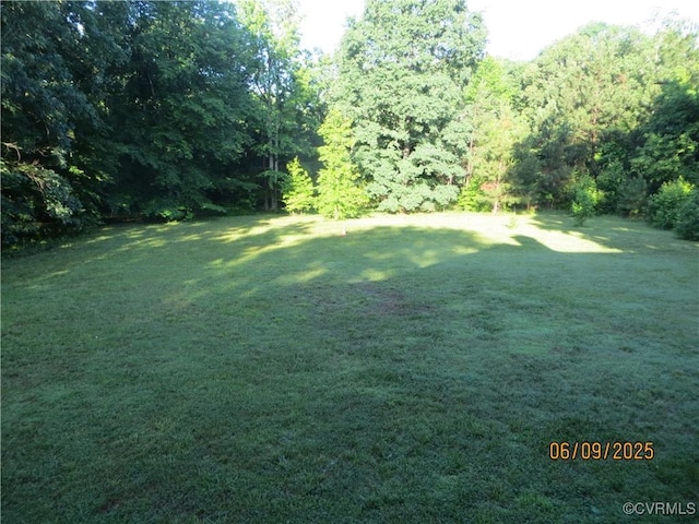 9630 Beaver Bridge Rd, Chesterfield, VA 23838 - view of green lawn featuring a view of trees