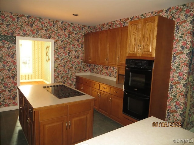 9630 Beaver Bridge Rd, Chesterfield, VA 23838 - kitchen with black appliances, dark tile patterned floors, light countertops, wallpapered walls, and a center island