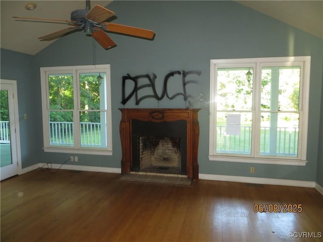 9630 Beaver Bridge Rd, Chesterfield, VA 23838 - unfurnished living room featuring vaulted ceiling, a ceiling fan, wood finished floors, healthy amount of natural light, and a fireplace with flush hearth