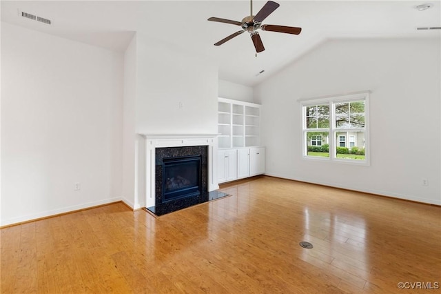 307 Kernel Ct, North Chesterfield, VA 23236 - unfurnished living room featuring a ceiling fan, vaulted ceiling, wood finished floors, and a premium fireplace