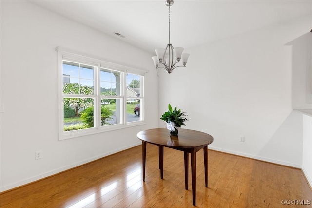 307 Kernel Ct, North Chesterfield, VA 23236 - dining area with a chandelier and light wood finished floors
