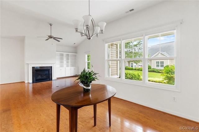 307 Kernel Ct, North Chesterfield, VA 23236 - living area featuring wood finished floors, ceiling fan, a fireplace, a chandelier, and vaulted ceiling