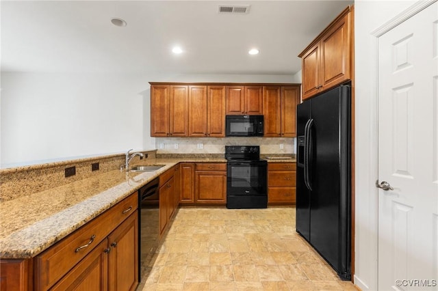 307 Kernel Ct, North Chesterfield, VA 23236 - kitchen with black appliances, brown cabinets, light stone counters, and recessed lighting