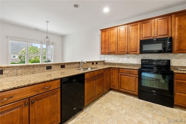 307 Kernel Ct, North Chesterfield, VA 23236 - kitchen with black appliances, light stone counters, brown cabinets, tasteful backsplash, and recessed lighting