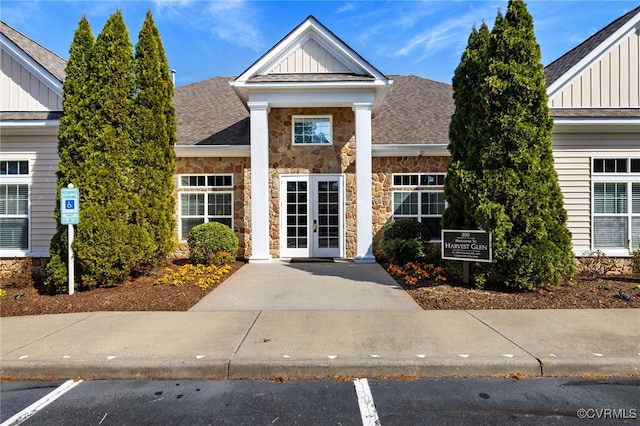 307 Kernel Ct, North Chesterfield, VA 23236 - property entrance with board and batten siding, stone siding, a shingled roof, and french doors