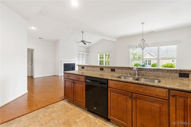 307 Kernel Ct, North Chesterfield, VA 23236 - kitchen with dishwasher, a ceiling fan, brown cabinetry, a fireplace, and lofted ceiling