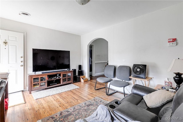 18 E 36th St, Richmond, VA 23224 - living room featuring arched walkways and wood finished floors