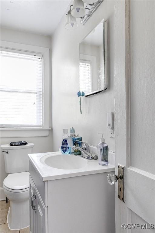 18 E 36th St, Richmond, VA 23224 - bathroom with vanity and tile patterned flooring