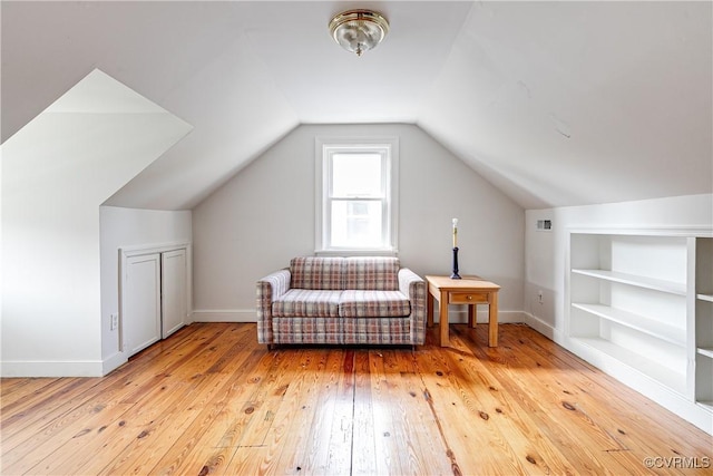 18 E 36th St, Richmond, VA 23224 - sitting room with wood-type flooring, built in shelves, and vaulted ceiling