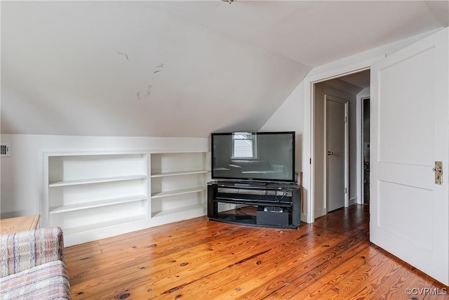 18 E 36th St, Richmond, VA 23224 - unfurnished living room with vaulted ceiling, wood finished floors, and built in features