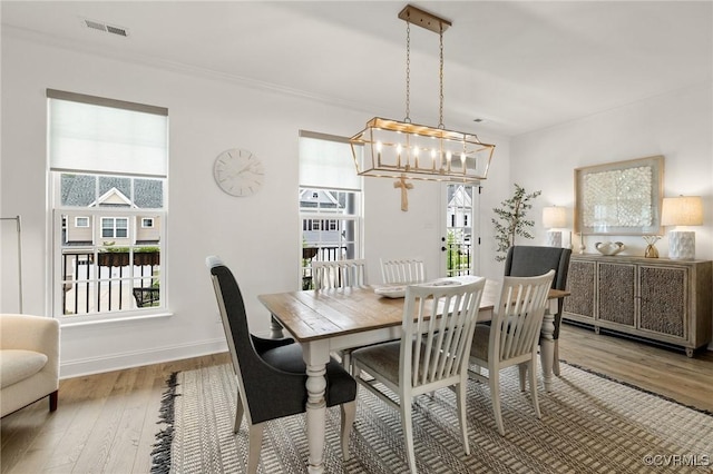 6988 Leire Ln, Chesterfield, VA 23832 - dining area featuring a chandelier, wood finished floors, and crown molding