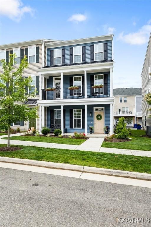 6988 Leire Ln, Chesterfield, VA 23832 - view of property featuring a balcony, a porch, and a front yard