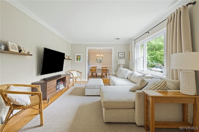 8507 Hanford Dr, Henrico, VA 23229 - living room featuring crown molding, a chandelier, and wood finished floors