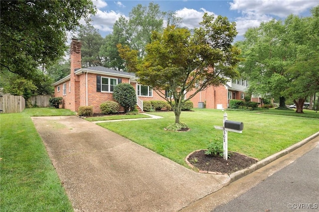8507 Hanford Dr, Henrico, VA 23229 - view of front of home featuring brick siding, driveway, and a chimney