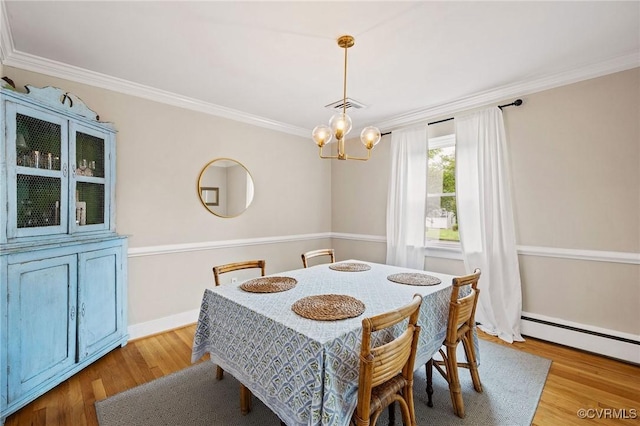 8507 Hanford Dr, Henrico, VA 23229 - dining space featuring baseboard heating, a chandelier, wood finished floors, and ornamental molding