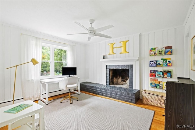 8507 Hanford Dr, Henrico, VA 23229 - office area featuring wood finished floors, a fireplace, ceiling fan, baseboard heating, and a decorative wall