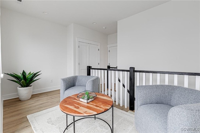 1823 W Cary St Unit A, Richmond, VA 23220 - living area featuring light wood-style flooring and an upstairs landing
