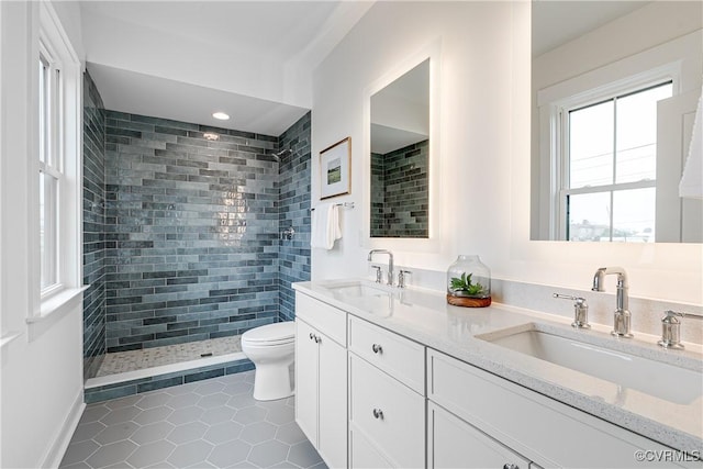 1823 W Cary St Unit A, Richmond, VA 23220 - bathroom featuring tile patterned flooring, double vanity, and tiled shower