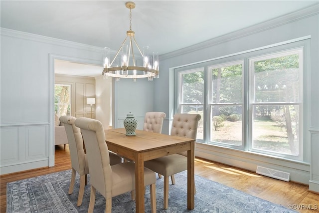 13511 W Salisbury Rd, Chesterfield, VA 23113 - dining space featuring a chandelier, wood finished floors, and crown molding