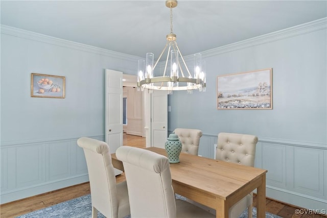 13511 W Salisbury Rd, Chesterfield, VA 23113 - dining room with a chandelier, ornamental molding, a decorative wall, wood finished floors, and wainscoting