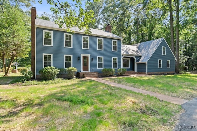 13511 W Salisbury Rd, Chesterfield, VA 23113 - colonial house featuring a chimney and a front lawn