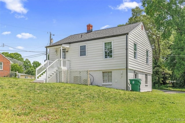 1505 Floyd St, Petersburg, VA 23803 - rear view of property featuring a chimney and a yard