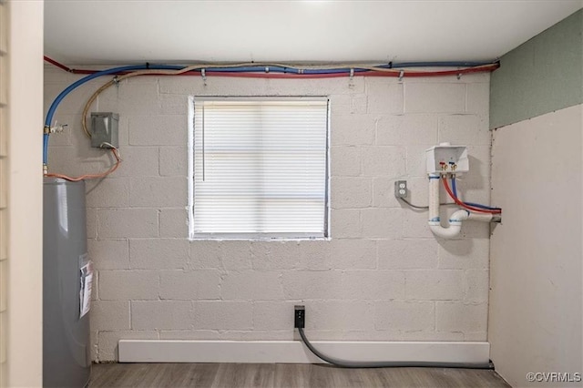 1505 Floyd St, Petersburg, VA 23803 - washroom with water heater, wood finished floors, hookup for a washing machine, and plenty of natural light