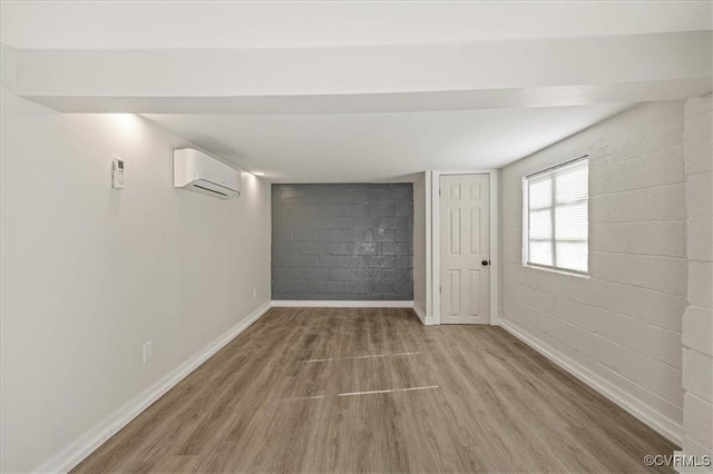 1505 Floyd St, Petersburg, VA 23803 - unfurnished bedroom featuring wood finished floors and an AC wall unit
