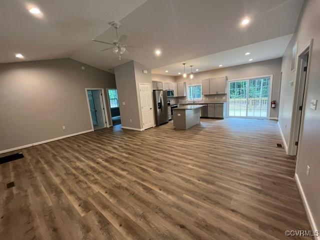 109 Maple Rd, Aylett, VA 23009 - kitchen with open floor plan, appliances with stainless steel finishes, a ceiling fan, wood finished floors, and lofted ceiling