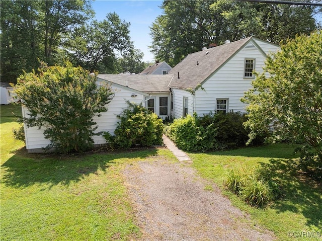 414 John St, Ashland, VA 23005 - view of front facade with a front yard and roof with shingles