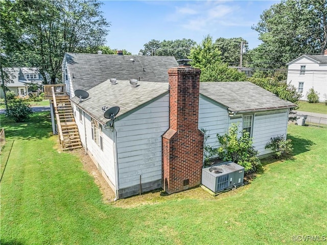 414 John St, Ashland, VA 23005 - rear view of property featuring stairs, a chimney, and a lawn