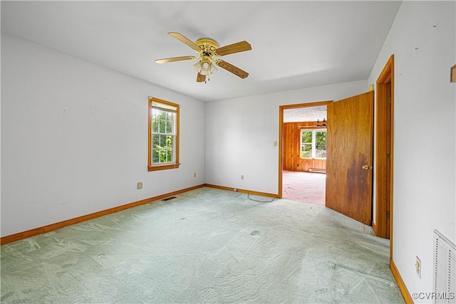 414 John St, Ashland, VA 23005 - carpeted empty room featuring plenty of natural light and a ceiling fan