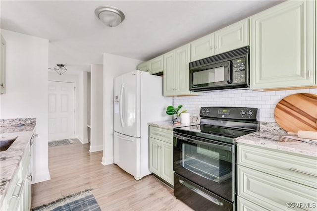 4814 Mill Park Ct, Glen Allen, VA 23060 - kitchen with black appliances, tasteful backsplash, light wood-style floors, and light stone counters