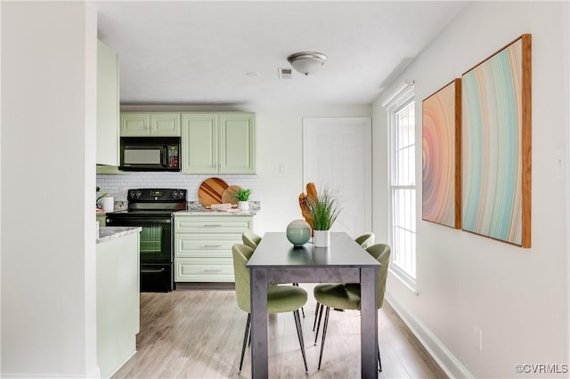 4814 Mill Park Ct, Glen Allen, VA 23060 - kitchen featuring black appliances, decorative backsplash, light countertops, and light wood finished floors