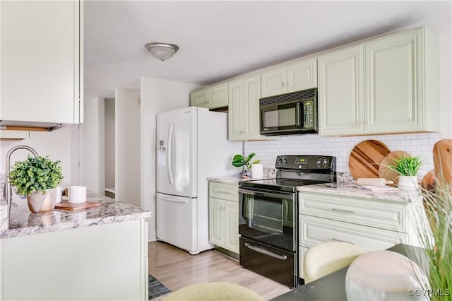 4814 Mill Park Ct, Glen Allen, VA 23060 - kitchen with black appliances, light wood-type flooring, backsplash, and light stone countertops